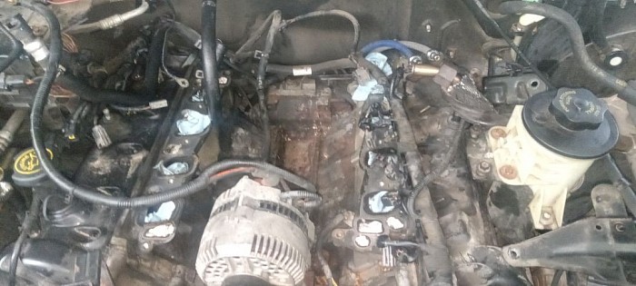 Had to replace intake manafold gasket so i could drill and retap treads in thermostat housung where bolt broke