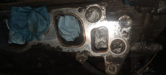 Broken bolt in cylinder head drilled out bolt and retaped treads to replace thermostat housing