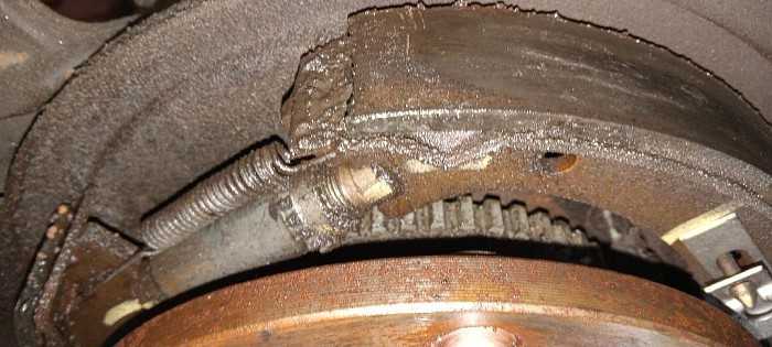 Bad axle seal contamenated rear brakes making brakes lock up when touch brake peadle